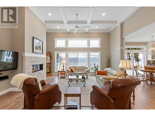 7255 Dunwaters Road, Kelowna, BC - Indoor Photo Showing Living Room With Fireplace