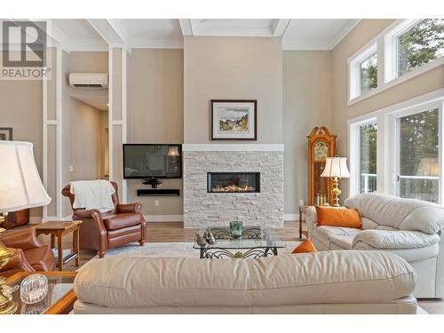 7255 Dunwaters Road, Kelowna, BC - Indoor Photo Showing Living Room With Fireplace