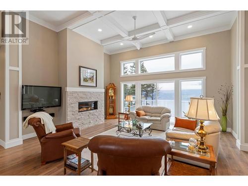 7255 Dunwaters Road, Kelowna, BC - Indoor Photo Showing Living Room With Fireplace