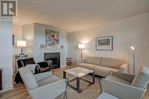 1003 - 700 Dynes Road, Burlington, ON - Indoor Photo Showing Living Room With Fireplace