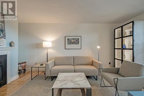 1003 - 700 Dynes Road, Burlington, ON - Indoor Photo Showing Living Room With Fireplace