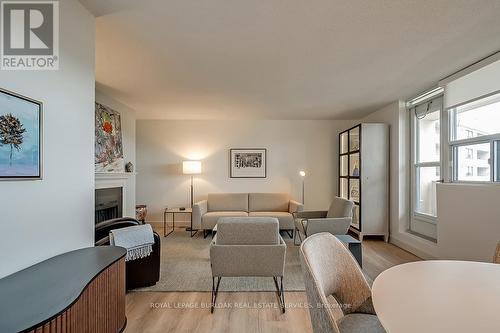 1003 - 700 Dynes Road, Burlington, ON - Indoor Photo Showing Living Room With Fireplace