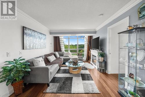 617 - 238 Bonis Avenue, Toronto, ON - Indoor Photo Showing Living Room With Fireplace