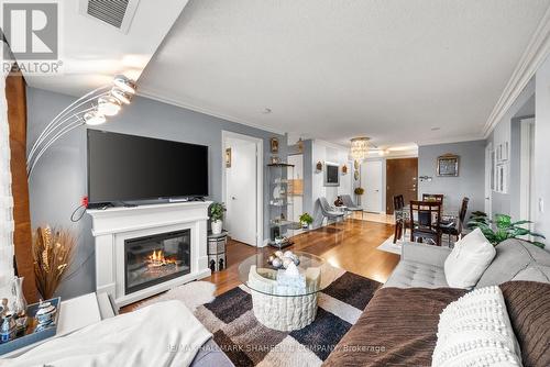 617 - 238 Bonis Avenue, Toronto, ON - Indoor Photo Showing Living Room With Fireplace