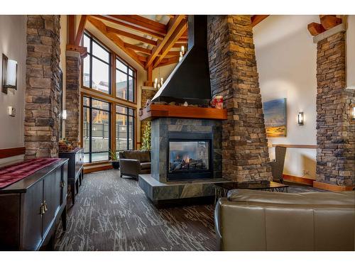 201 - 400 Stemwinder Drive, Kimberley, BC - Indoor Photo Showing Living Room With Fireplace