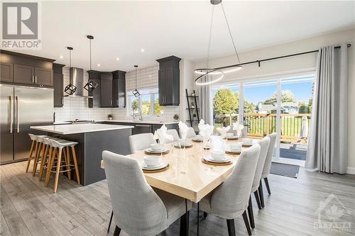 The heart of this home is the open-concept kitchen, a chef's dream come true. This space seamlessly flows into the living and dining areas, making it perfect for both entertaining and everyday liv - 708 Geneva Crescent, Embrun, ON - Indoor Photo Showing Dining Room