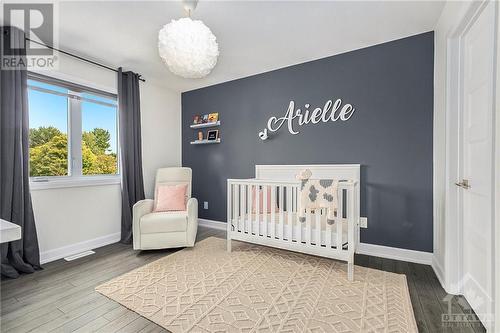 Another beautifully appointed bedroom features a large closet, providing ample storage for clothing and personal items. This room is further enhanced by a stylish designer light fixture, adding a - 708 Geneva Crescent, Embrun, ON - Indoor Photo Showing Bedroom