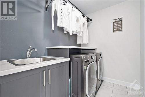 Convenience meets functionality with the well-appointed second-floor laundry room. Designed to make daily chores easier, this space offers ample room for both a washer and dryer, along with additi - 708 Geneva Crescent, Embrun, ON - Indoor Photo Showing Laundry Room