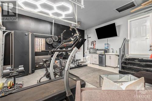 The spacious 3-car garage is more than just a place to park your vehicles—it’s a versatile space that offers endless possibilities. Set up a home gym or workshop, this garage is designed to accomm - 708 Geneva Crescent, Embrun, ON - Indoor Photo Showing Gym Room