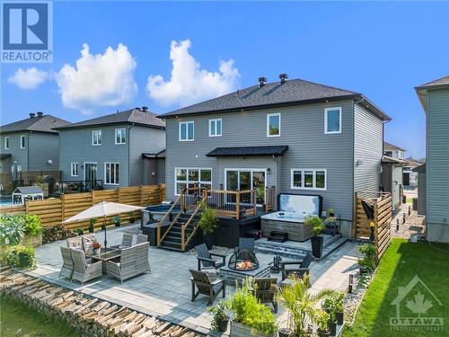 From every angle this backyard retreat welcomes you.  Deck, patio, dining, cozy fire pit.  This has it all.  Come see yourself in this inviting space. - 708 Geneva Crescent, Embrun, ON - Outdoor With Deck Patio Veranda With Exterior