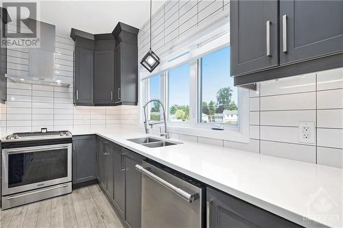 The beautiful quartz surfaces not only elevate the kitchen’s look but also offer a durable and easy-to-maintain workspace. These elegant cabinets extend to the ceiling, providing ample storage spa - 708 Geneva Crescent, Embrun, ON - Indoor Photo Showing Kitchen With Double Sink With Upgraded Kitchen