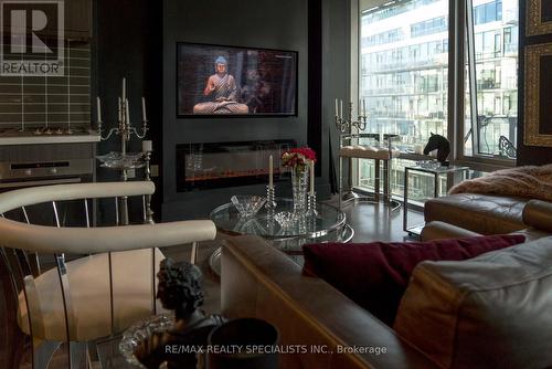 830 - 39 Queens Quay E, Toronto, ON - Indoor Photo Showing Living Room With Fireplace