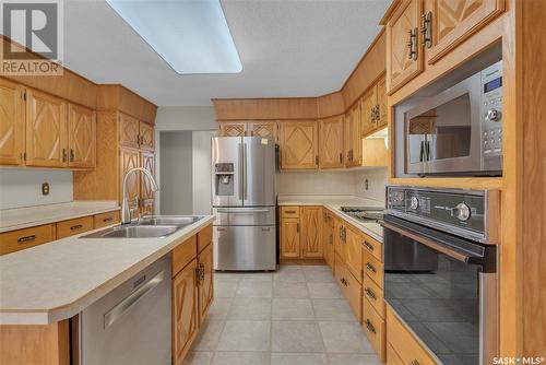 443 Whiteswan Drive, Saskatoon, SK - Indoor Photo Showing Kitchen With Stainless Steel Kitchen With Double Sink