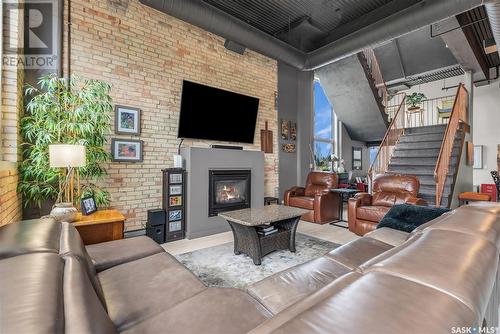 206 211 D Avenue N, Saskatoon, SK - Indoor Photo Showing Living Room With Fireplace