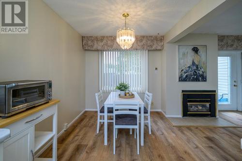 185 111 Tabor Boulevard, Prince George, BC - Indoor Photo Showing Dining Room With Fireplace