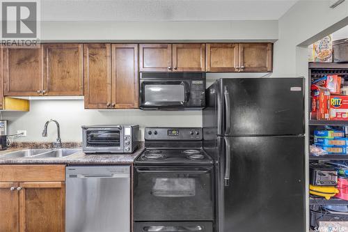 12 210 Camponi Place, Saskatoon, SK - Indoor Photo Showing Kitchen With Double Sink