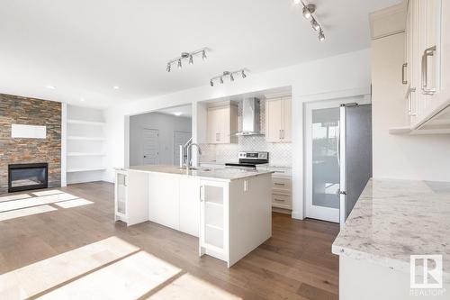 21351 96 Av Nw, Edmonton, AB - Indoor Photo Showing Kitchen With Fireplace With Double Sink With Upgraded Kitchen