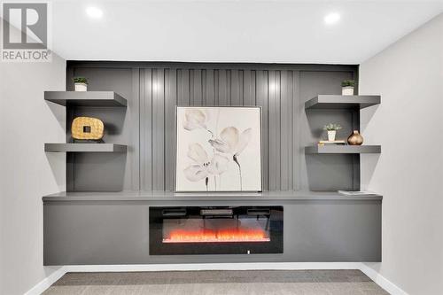 7708 Silver Springs Road Nw, Calgary, AB - Indoor Photo Showing Other Room With Fireplace