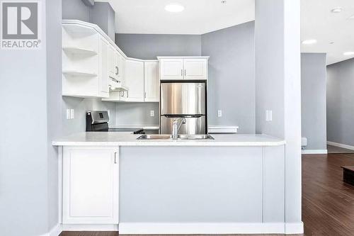 Sneaky storage cupboard - 1203, 1514 11 Street Sw, Calgary, AB - Indoor Photo Showing Kitchen