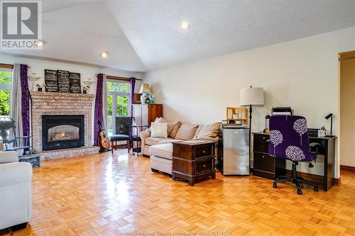 302 Applewood, Kingsville, ON - Indoor Photo Showing Living Room With Fireplace