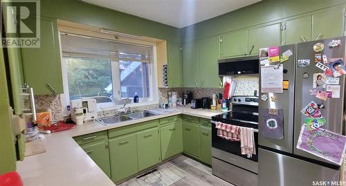 214 Centre Avenue, Meadow Lake, SK - Indoor Photo Showing Kitchen With Double Sink