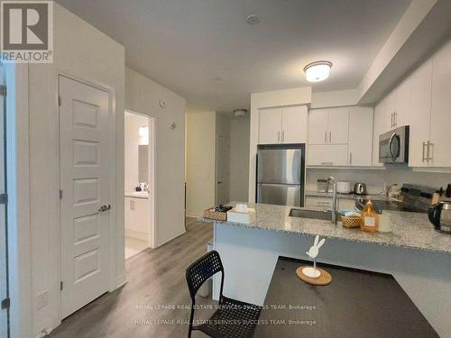 325 - 128 Grovewood Common, Oakville, ON - Indoor Photo Showing Kitchen With Stainless Steel Kitchen