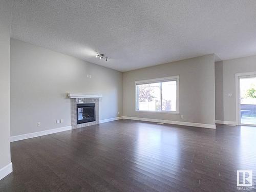 2226 Ware Co Nw, Edmonton, AB - Indoor Photo Showing Living Room With Fireplace