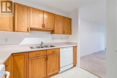 3309, 3000 Sienna Park Green Sw, Calgary, AB - Indoor Photo Showing Kitchen With Double Sink