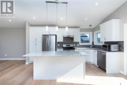 1107 Evergreen Boulevard, Saskatoon, SK - Indoor Photo Showing Kitchen With Stainless Steel Kitchen With Upgraded Kitchen