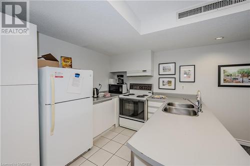 100 Bronte Road Unit# 408, Oakville, ON - Indoor Photo Showing Kitchen With Double Sink