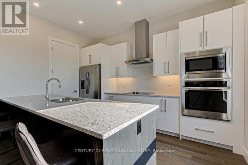 202 - 1696 Fiddlehead Place, London, ON - Indoor Photo Showing Kitchen With Double Sink With Upgraded Kitchen