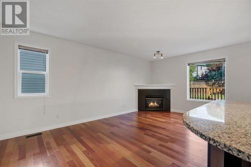 24 Tuscarora Place Nw, Calgary, AB - Indoor With Fireplace