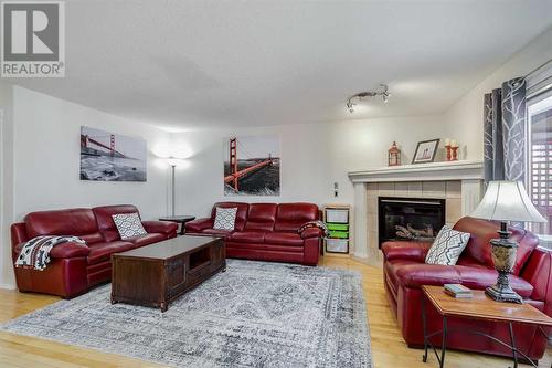 110 Citadel Meadow Bay Nw, Calgary, AB - Indoor Photo Showing Living Room With Fireplace