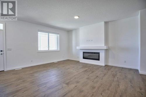 131 Legacy Reach Court Se, Calgary, AB - Indoor With Fireplace