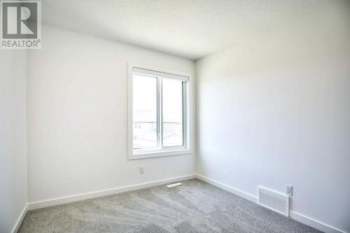 131 Legacy Reach Court Se, Calgary, AB - Indoor Photo Showing Other Room