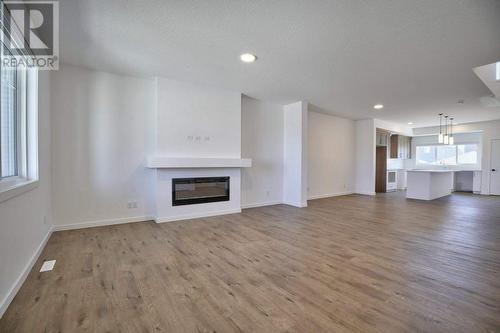 131 Legacy Reach Court Se, Calgary, AB - Indoor Photo Showing Living Room With Fireplace