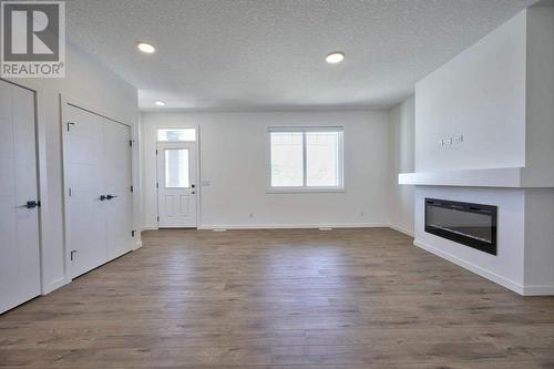 131 Legacy Reach Court Se, Calgary, AB - Indoor With Fireplace