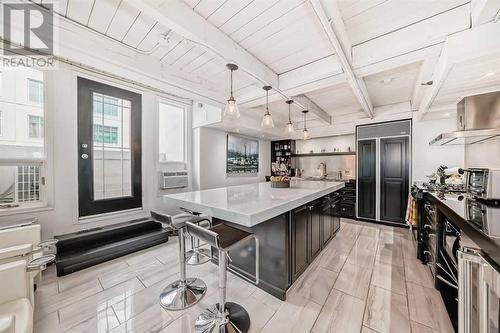 203, 1117 1 Street Sw, Calgary, AB - Indoor Photo Showing Kitchen With Stainless Steel Kitchen With Upgraded Kitchen