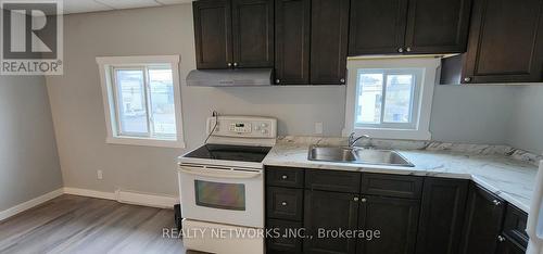 242 244 248 Cedart Street S, Timmins (Timmins South - East), ON - Indoor Photo Showing Kitchen With Double Sink