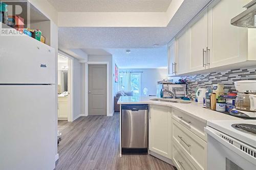 306, 1820 9, Calgary, AB - Indoor Photo Showing Kitchen With Double Sink