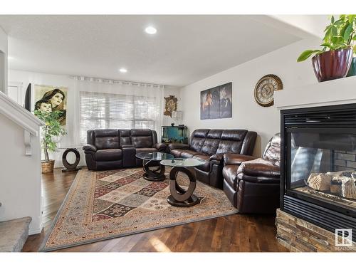 3607 13 St Nw, Edmonton, AB - Indoor Photo Showing Living Room With Fireplace