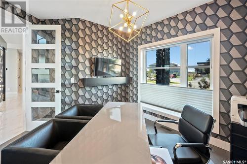 205 Greenbryre Lane, Greenbryre, SK - Indoor Photo Showing Kitchen With Fireplace