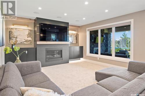 205 Greenbryre Lane, Greenbryre, SK - Indoor Photo Showing Living Room With Fireplace