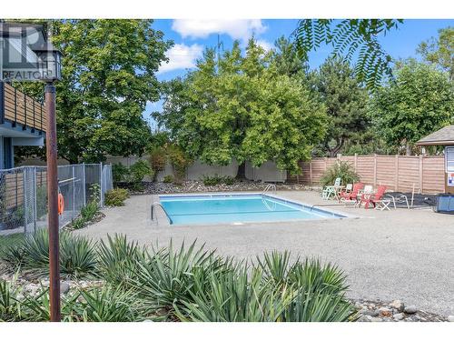 2125 Burtch Road Unit# 410, Kelowna, BC - Outdoor With In Ground Pool With Backyard