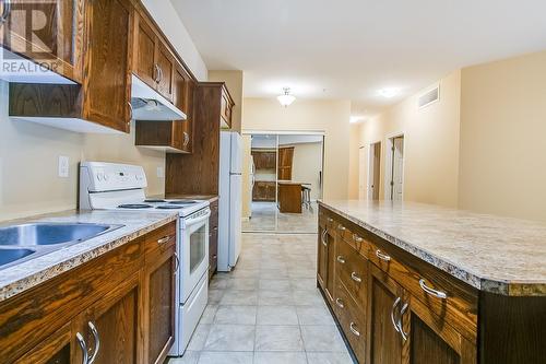 1905 Pandosy Street Unit# 108, Kelowna, BC - Indoor Photo Showing Kitchen With Double Sink