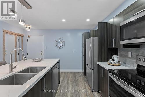 104 - 4205 Shipp Dr Drive, Mississauga, ON - Indoor Photo Showing Kitchen With Double Sink With Upgraded Kitchen