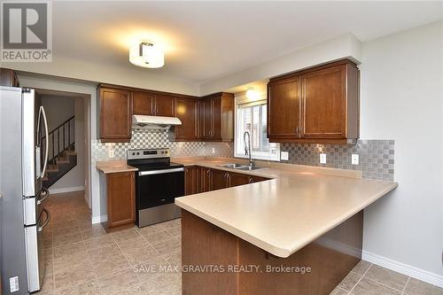 310 Brigadoon Drive, Hamilton, ON - Indoor Photo Showing Kitchen With Double Sink