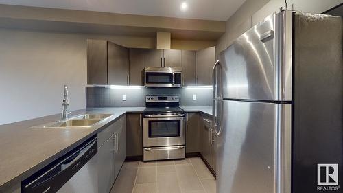 #417 10611 117 St Nw, Edmonton, AB - Indoor Photo Showing Kitchen With Double Sink