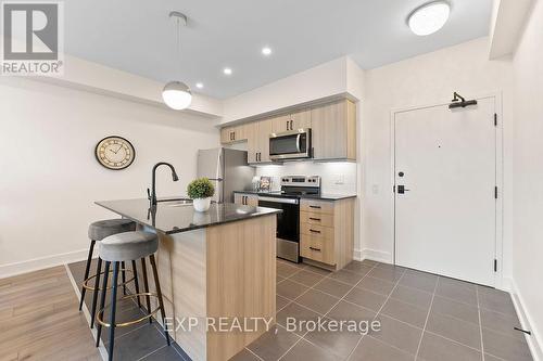 506 - 4 Spice Way, Barrie, ON - Indoor Photo Showing Kitchen With Stainless Steel Kitchen