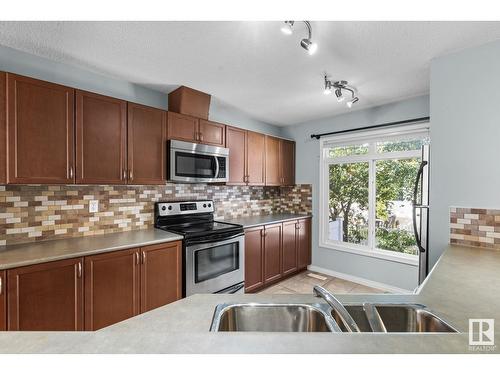 #22 1804 70 St Sw, Edmonton, AB - Indoor Photo Showing Kitchen With Stainless Steel Kitchen